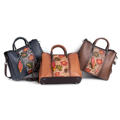 Three color options of the floral leather bag shown together