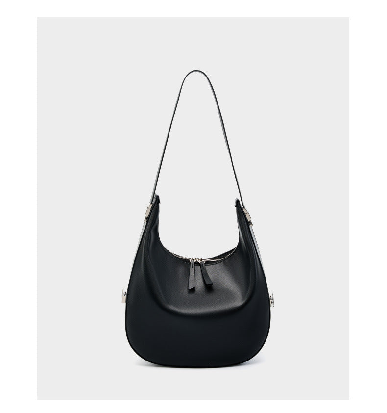 Front view of the black cowhide leather crescent hobo bag with the shoulder strap fully extended