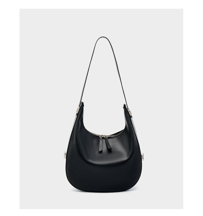 Front view of the black cowhide leather crescent hobo bag with the shoulder strap fully extended