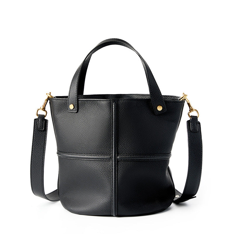 Black top-grain cowhide bucket bag on white background