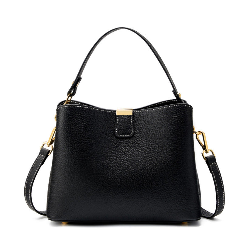 Black pebbled leather bucket bag on white background