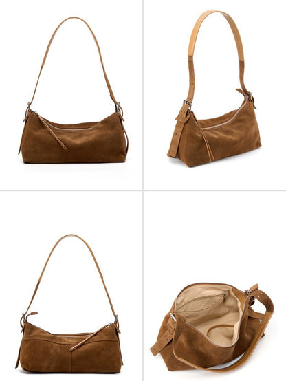 Suede shoulder bag worn close to the body