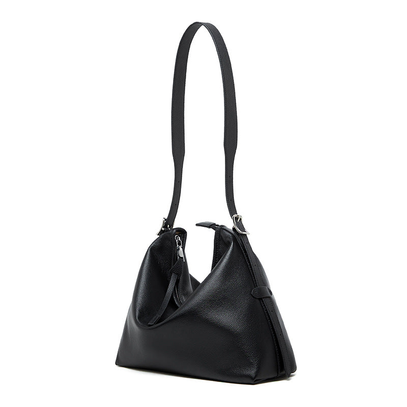 Black leather shoulder bag on white background