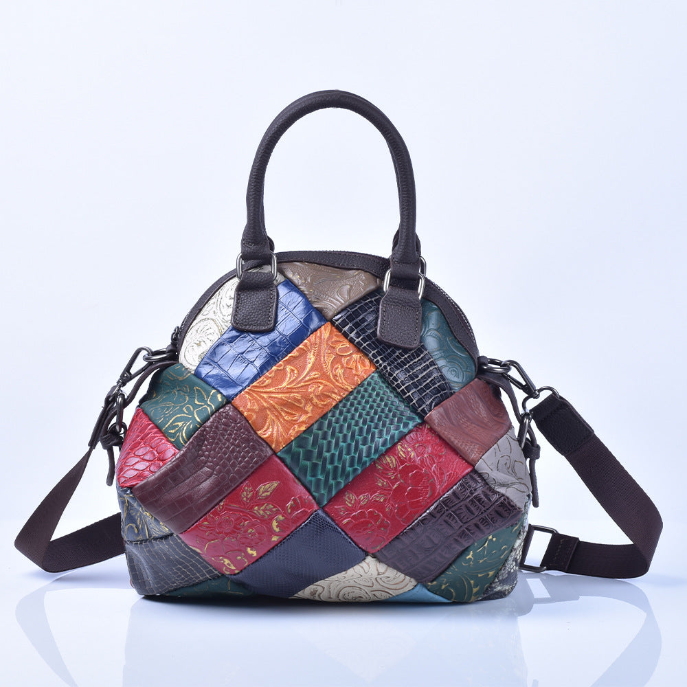 Front view of the rounded patchwork shoulder bag with top handles