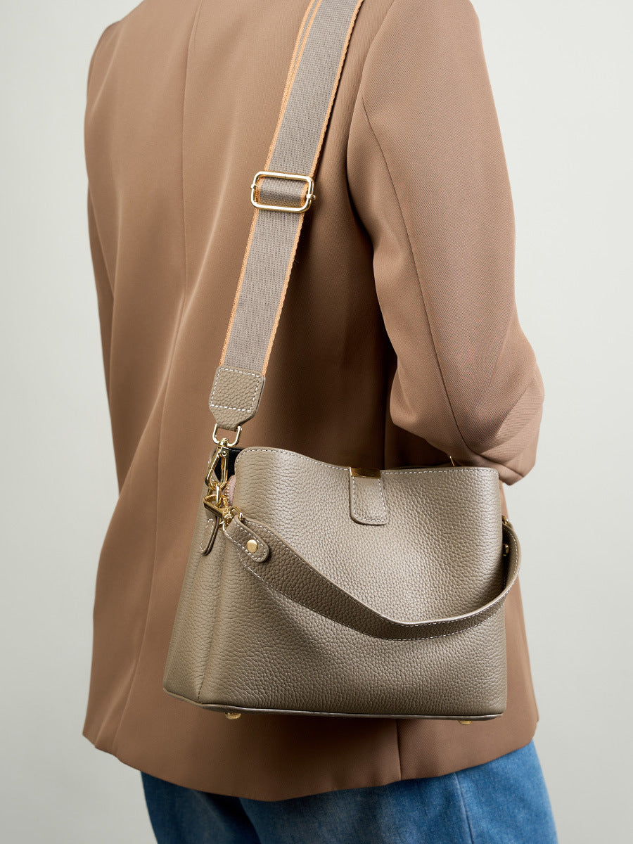 Back view of the brown leather bag worn on the shoulder