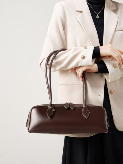 Coffee leather baguette bag with zip-top closure detail