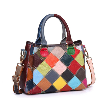 Angled front view showing the quilted color-block shell bag silhouette