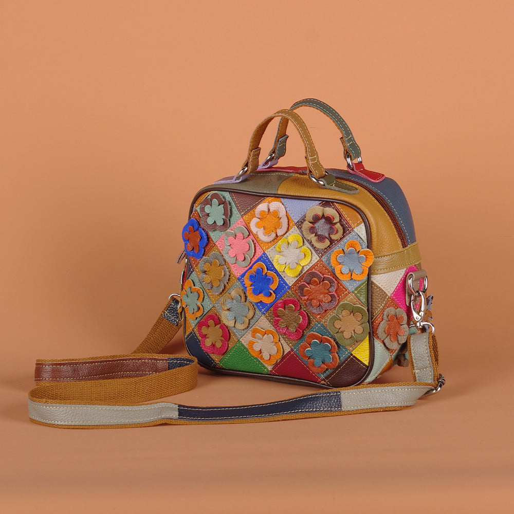 Multicolor patchwork cowhide bag with contrasting flower details