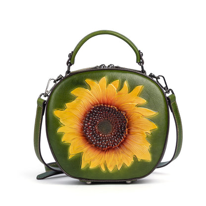 Front view of the green cowhide sunflower bag against a light background