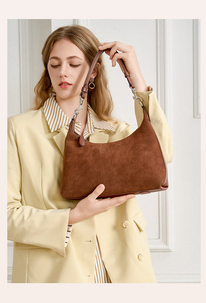 Close lifestyle view of the bag carried by its strap