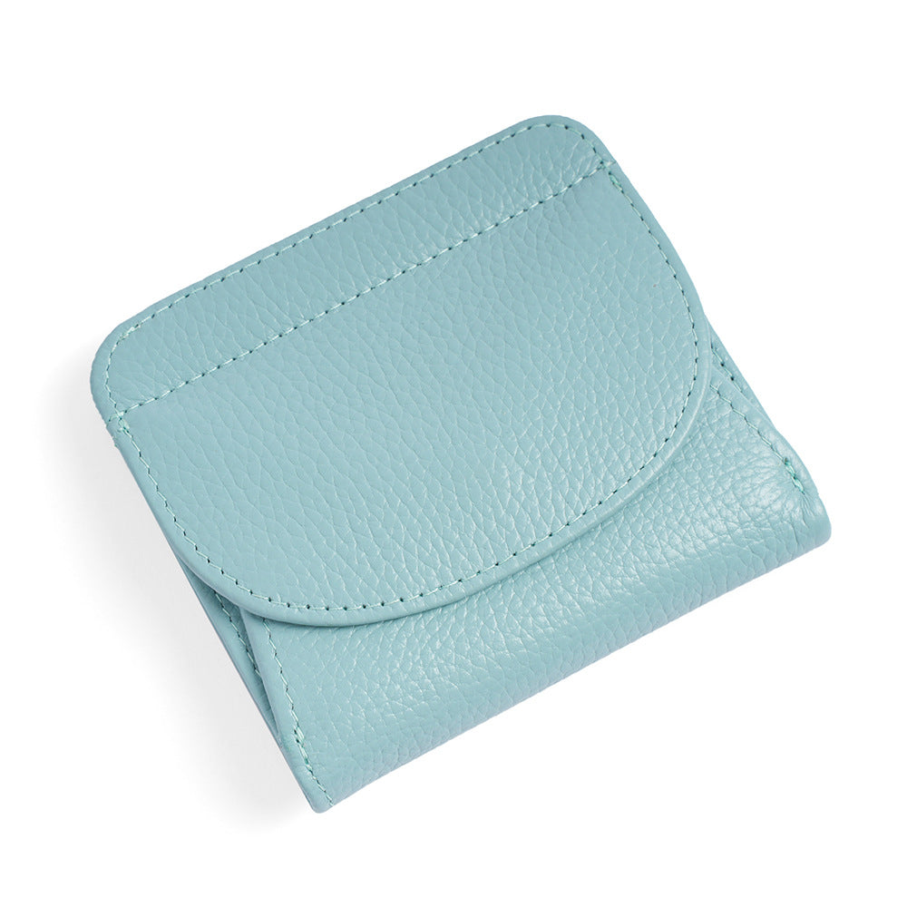 Lake blue leather wallet with snap closure on white background