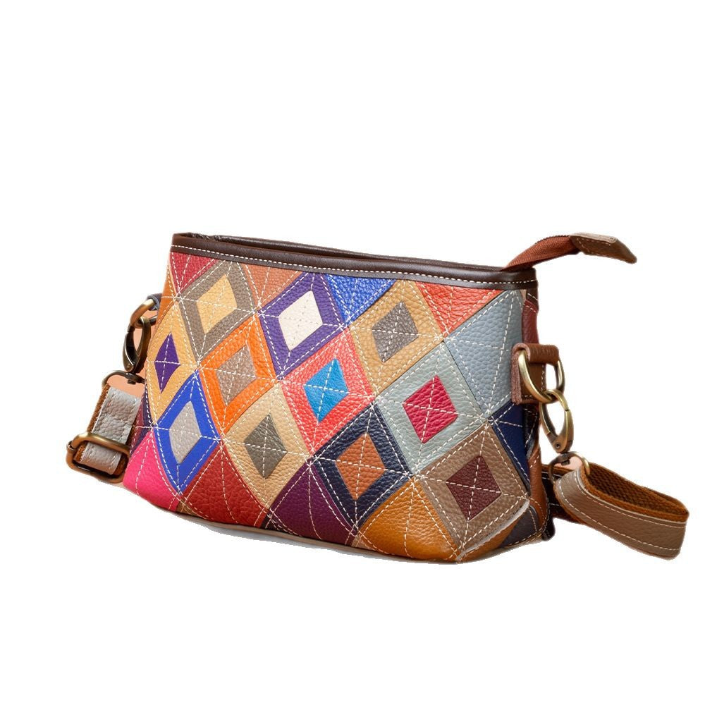 Angled view showing colorful stitched panels and side strap attachments