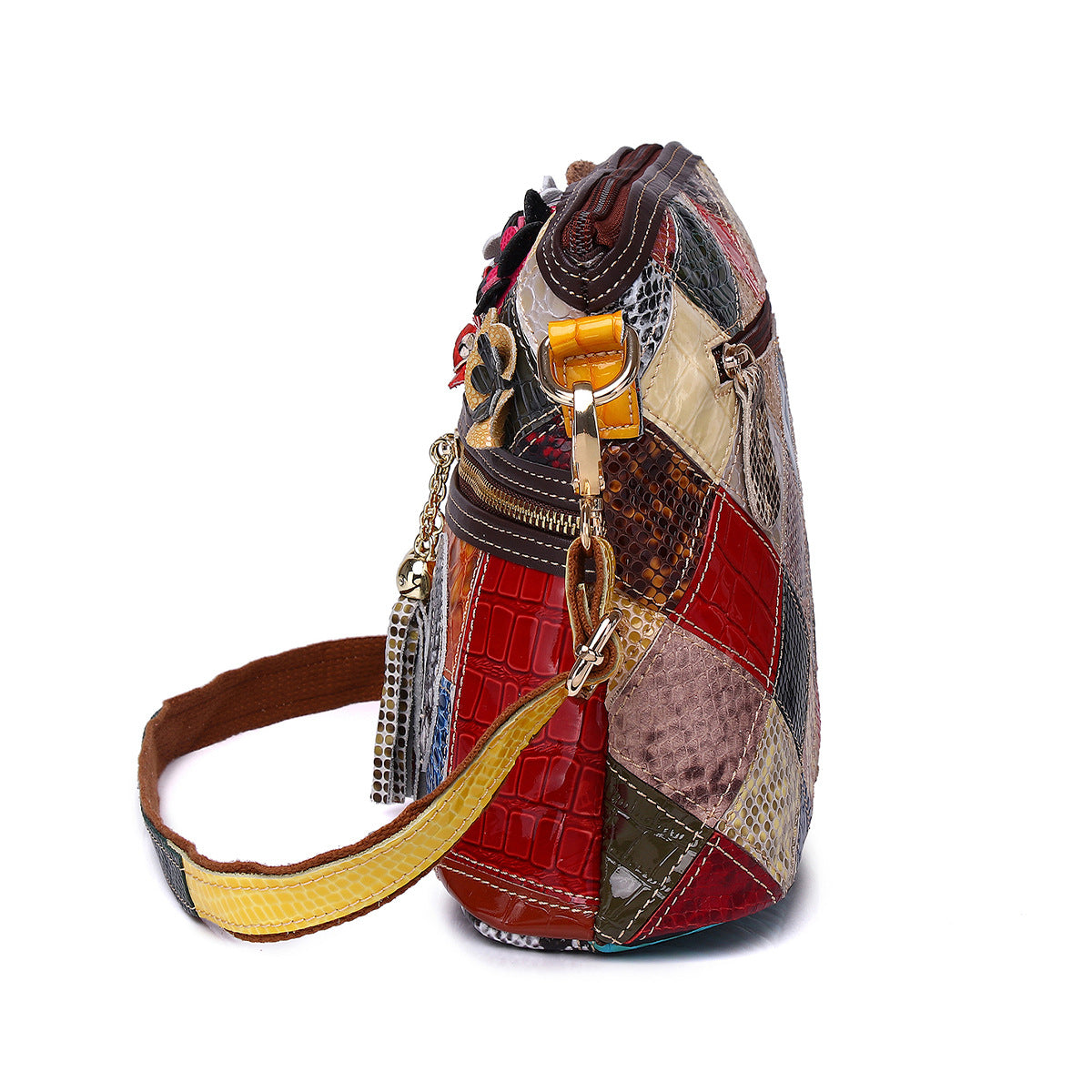 Side view showing textured panels and strap attachment on the leather bag