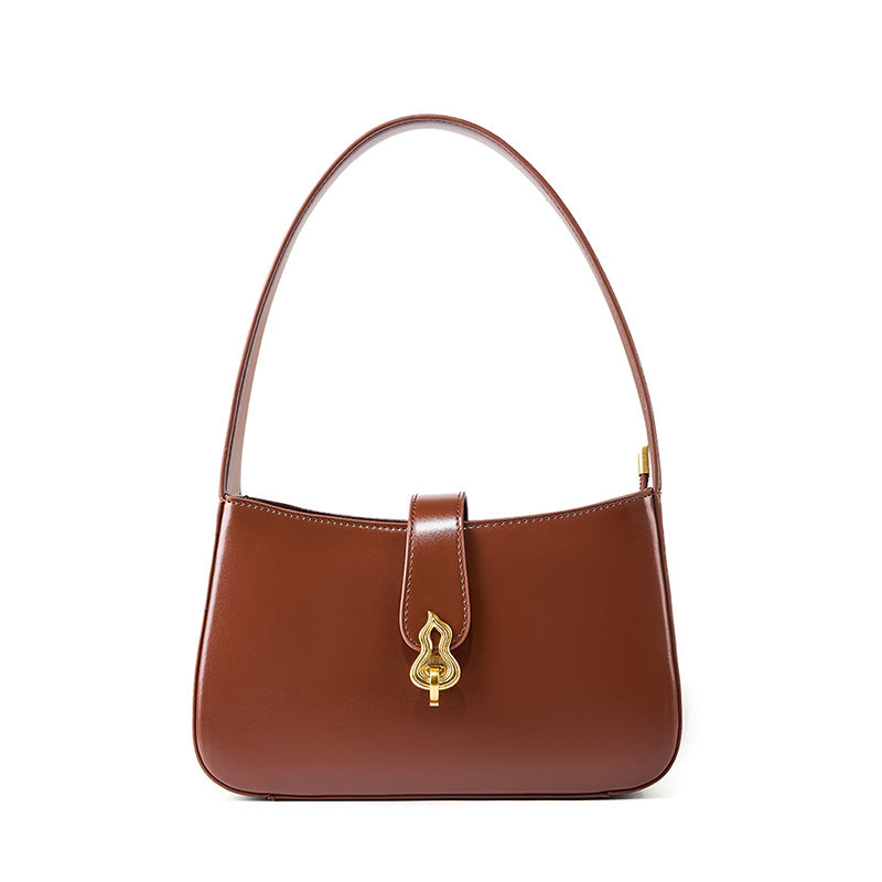 Coffee brown cowhide leather shoulder bag with gold gourd clasp on white background