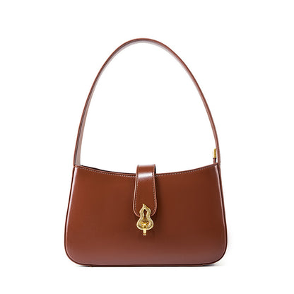 Coffee brown cowhide leather shoulder bag with gold gourd clasp on white background
