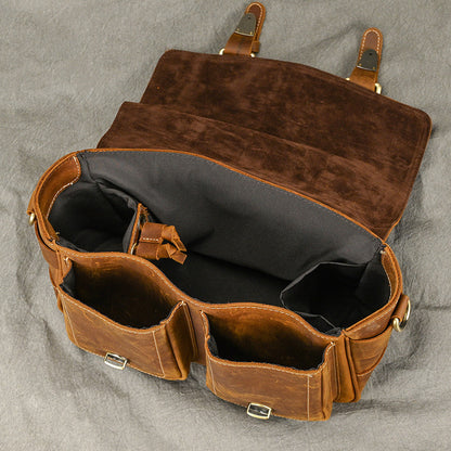 Open camera bag showing polyester-lined interior and dividers