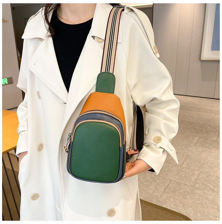 Black-front sling bag worn on the back