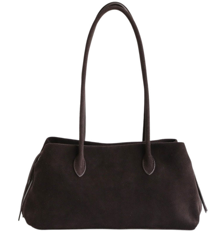 Coffee-colored nubuck tote with long handles on a white background