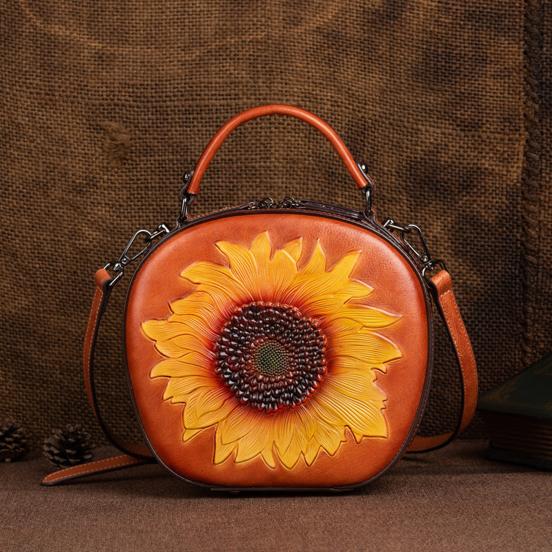 Vintage brown round cowhide crossbody bag with raised sunflower front
