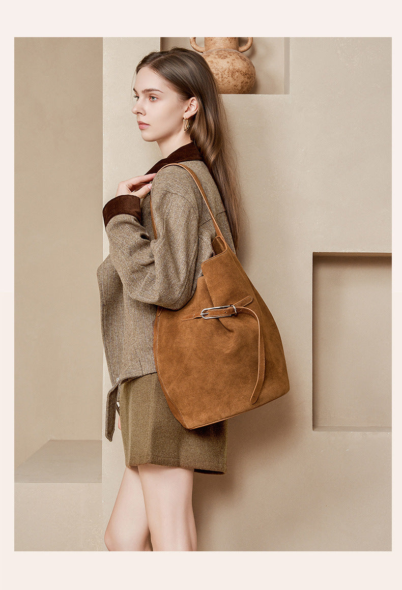 Caramel suede cowhide shoulder tote worn over the shoulder
