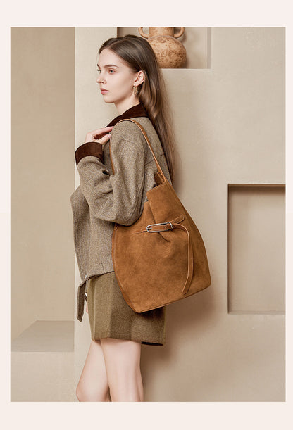 Caramel suede cowhide shoulder tote worn over the shoulder