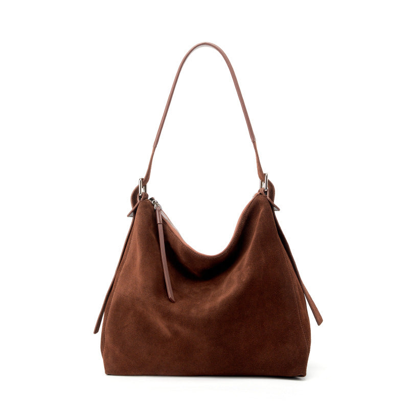 Coffee suede cowhide tote bag on a white background