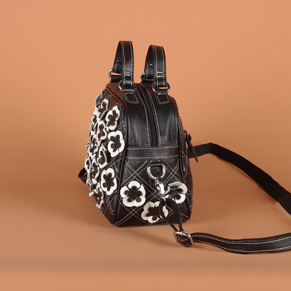Side profile showing the bag depth, top handles, and shoulder strap