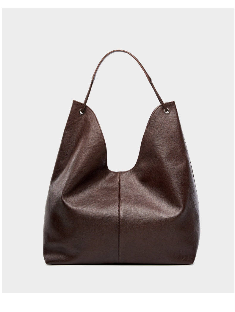 Dark brown hobo tote bag back view on light gray background