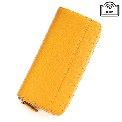 Yellow leather wallet with stitching on white background