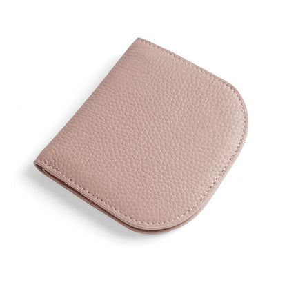 Light pink pebbled cowhide leather bifold wallet closed on white background