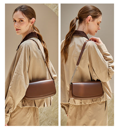 Two views of the brown baguette bag styled under the arm and crossbody