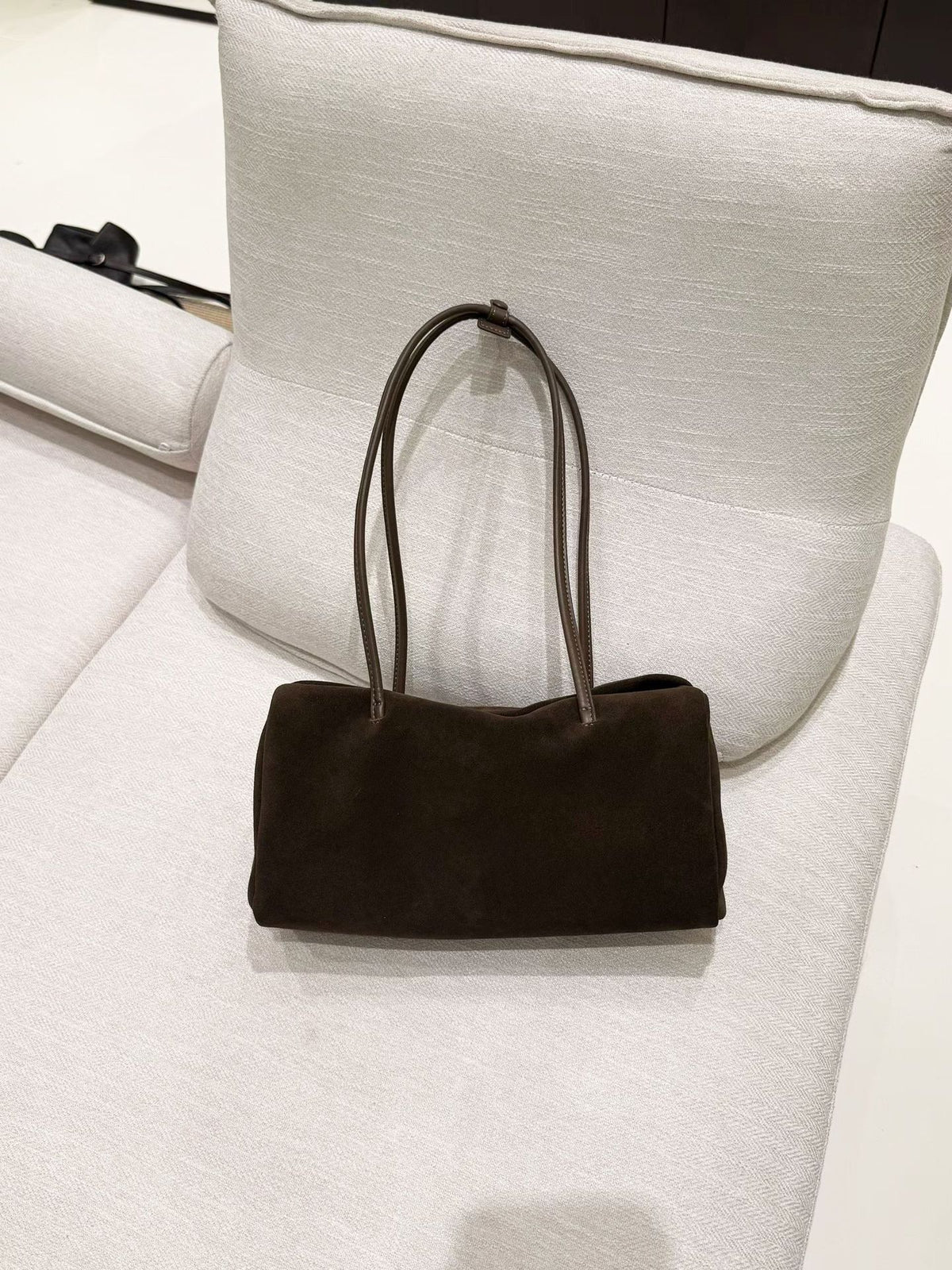 Dark brown Boston shoulder tote displayed against a neutral backdrop