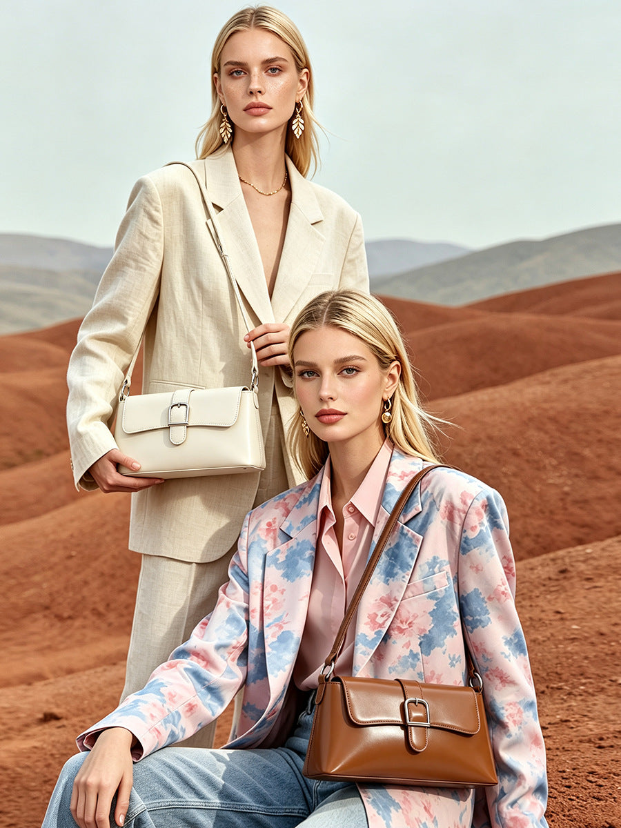 White and brown baguette bags held by models in blazers