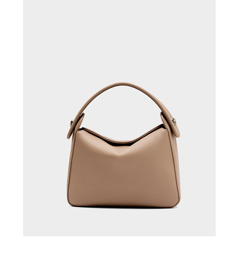 Front view of milk tea pebbled cowhide top-handle bag