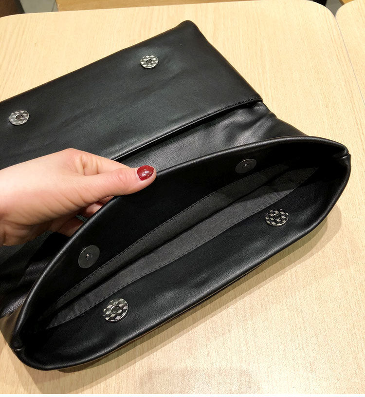 Clutch interior with central divider and pocket details