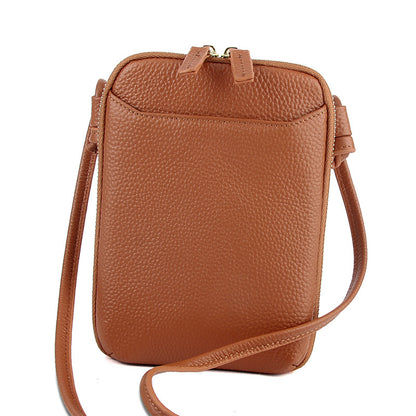 Brown pebbled cowhide crossbody phone bag with dual leather zip pulls