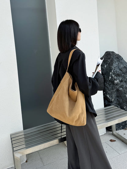 Full-length outfit with a large caramel tote