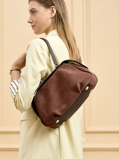Brown suede bag worn over the shoulder