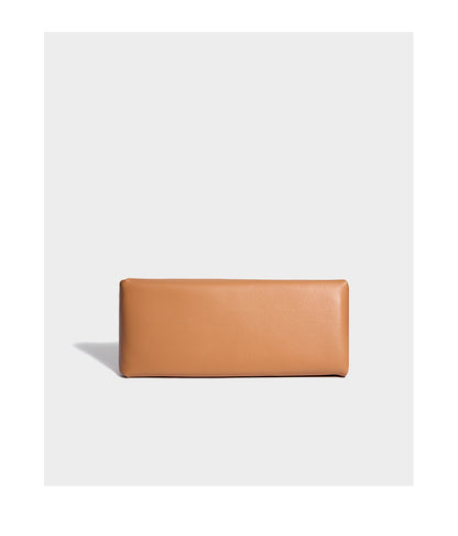 Apricot pillow crossbody bag bottom view showing base