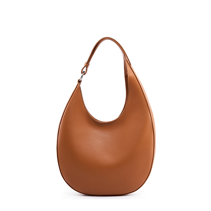 Brown cowhide crescent hobo bag front view on white background