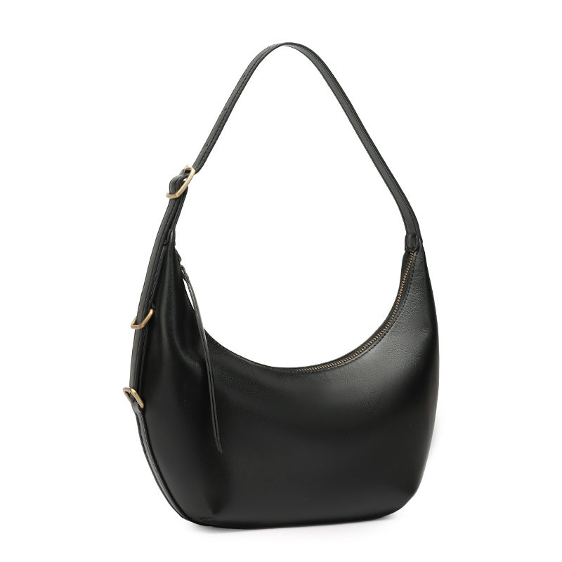 Black crescent leather bag on white background