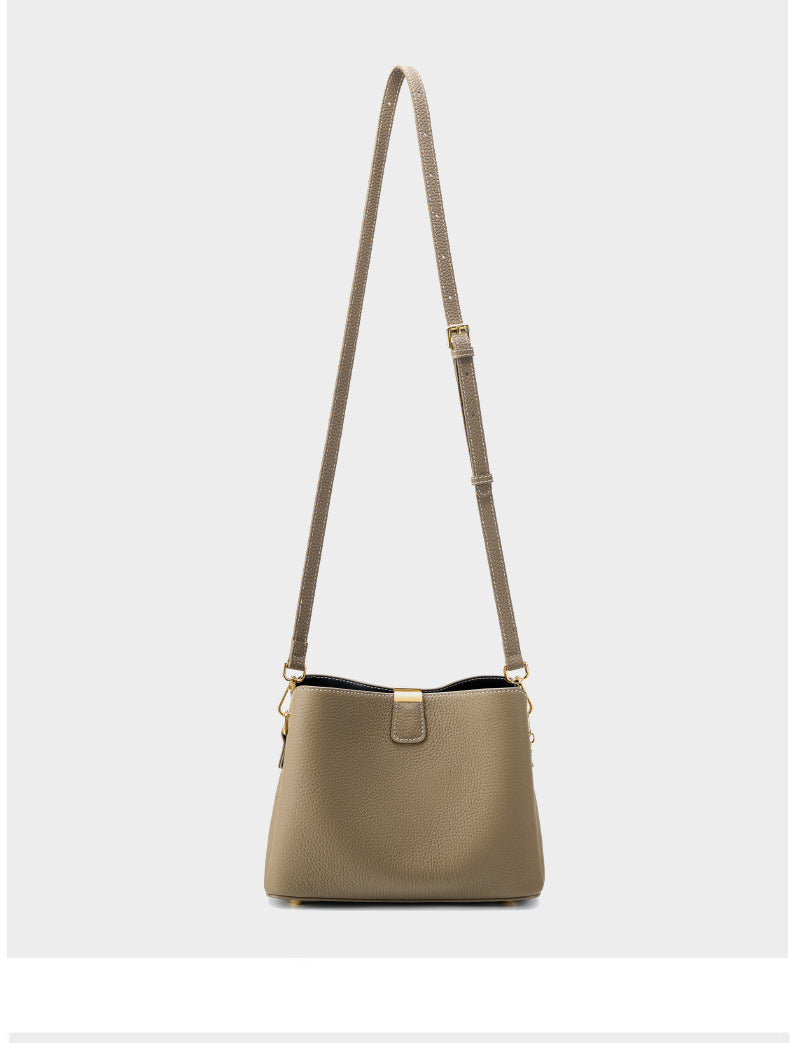 Full view of the bag's leather shoulder strap
