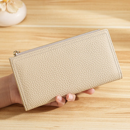 Closed long beige cowhide wallet with a top zipper