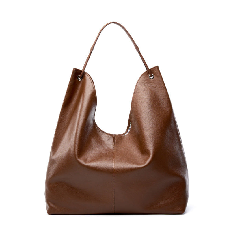 Brown cowhide leather hobo tote bag front view on white background