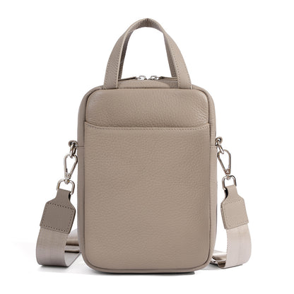Light gray pebbled leather mini crossbody phone bag with detachable woven strap and top handles