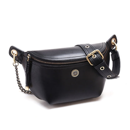 Front view of black split leather belt bag with decorative sunburst and zip closure