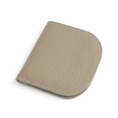 Light grey pebbled cowhide leather bifold wallet closed on white background
