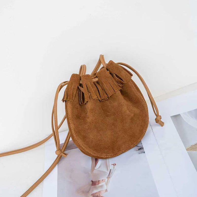 Caramel suede leather bucket bag shown from the front