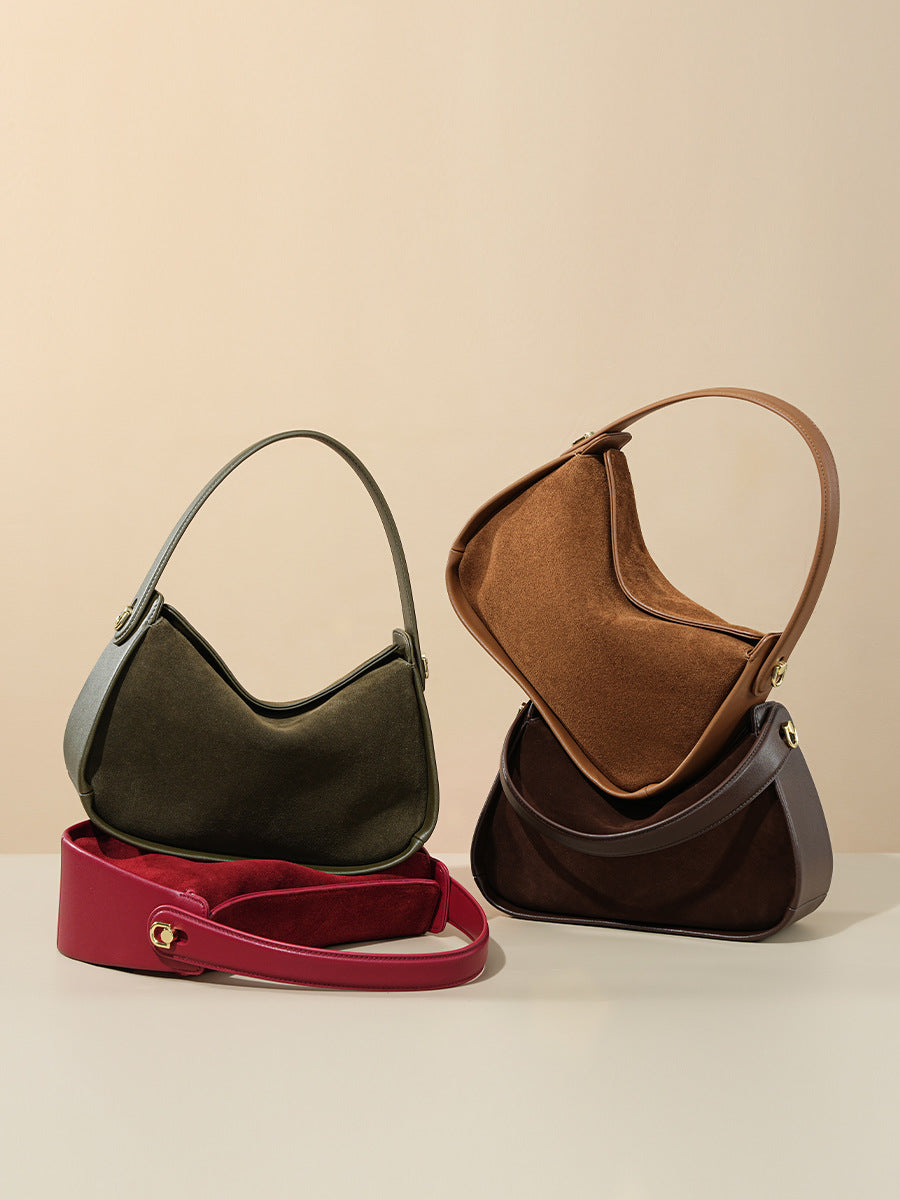 Four color options of the suede shoulder bag arranged together