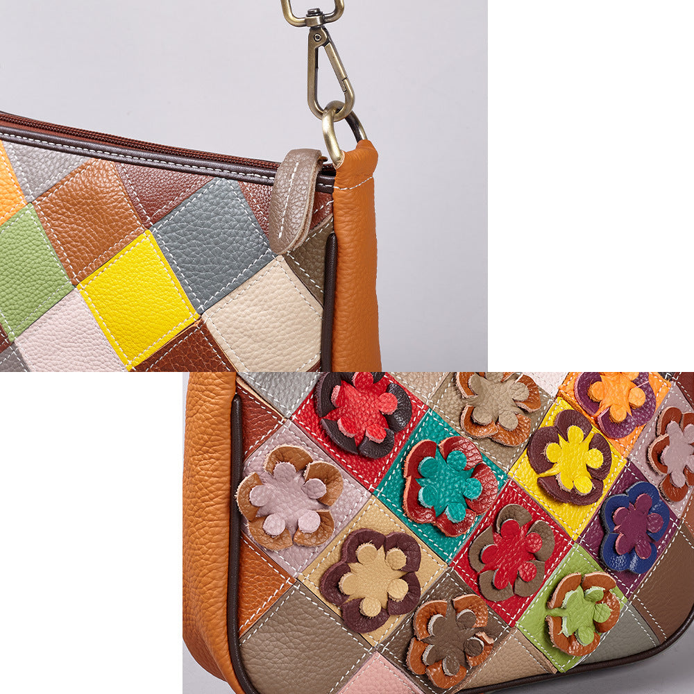 Close-up of colorful leather patchwork, flower appliques, and metal strap hardware